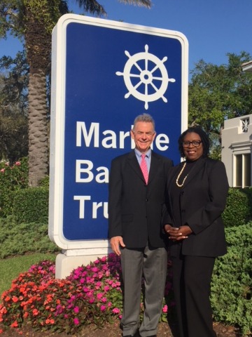 Marine Bank President and CEO Bill Penney with Indian River County Minority Scholarship Recipient Jonnie Mae Perry of Gifford Community Cultural & Resource Center in front of Marine Bank & Trust’s Headquarters in Vero Beach.